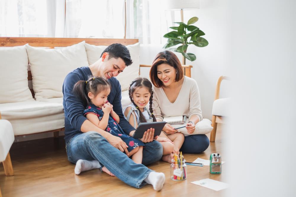 family enjoying time together at home when parents are taking time off from work