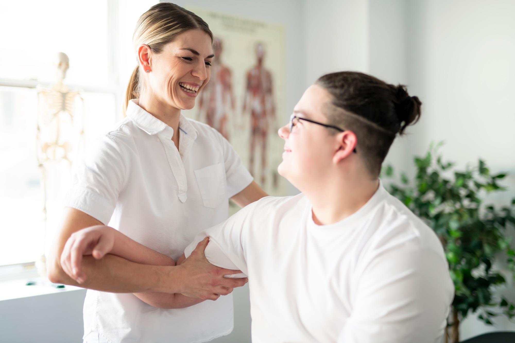 occupational therapist helping a patient