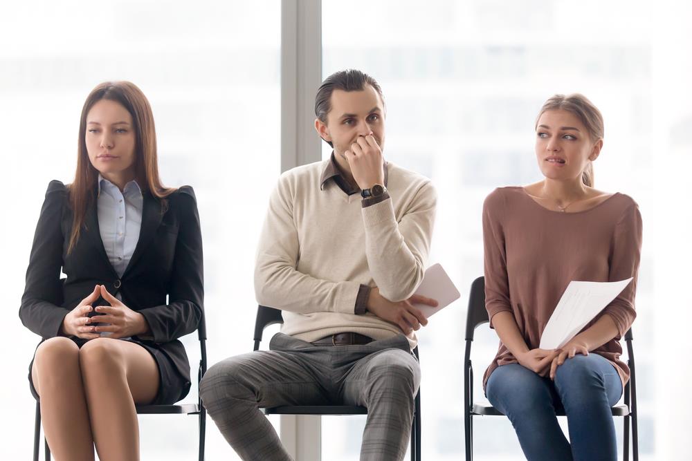 group of nervous job seekers unsure about the strength of their resumes