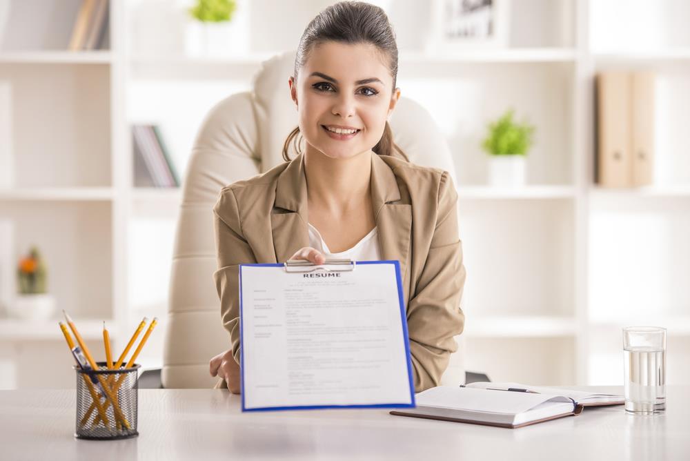 job seeker proudly displaying her improved resume