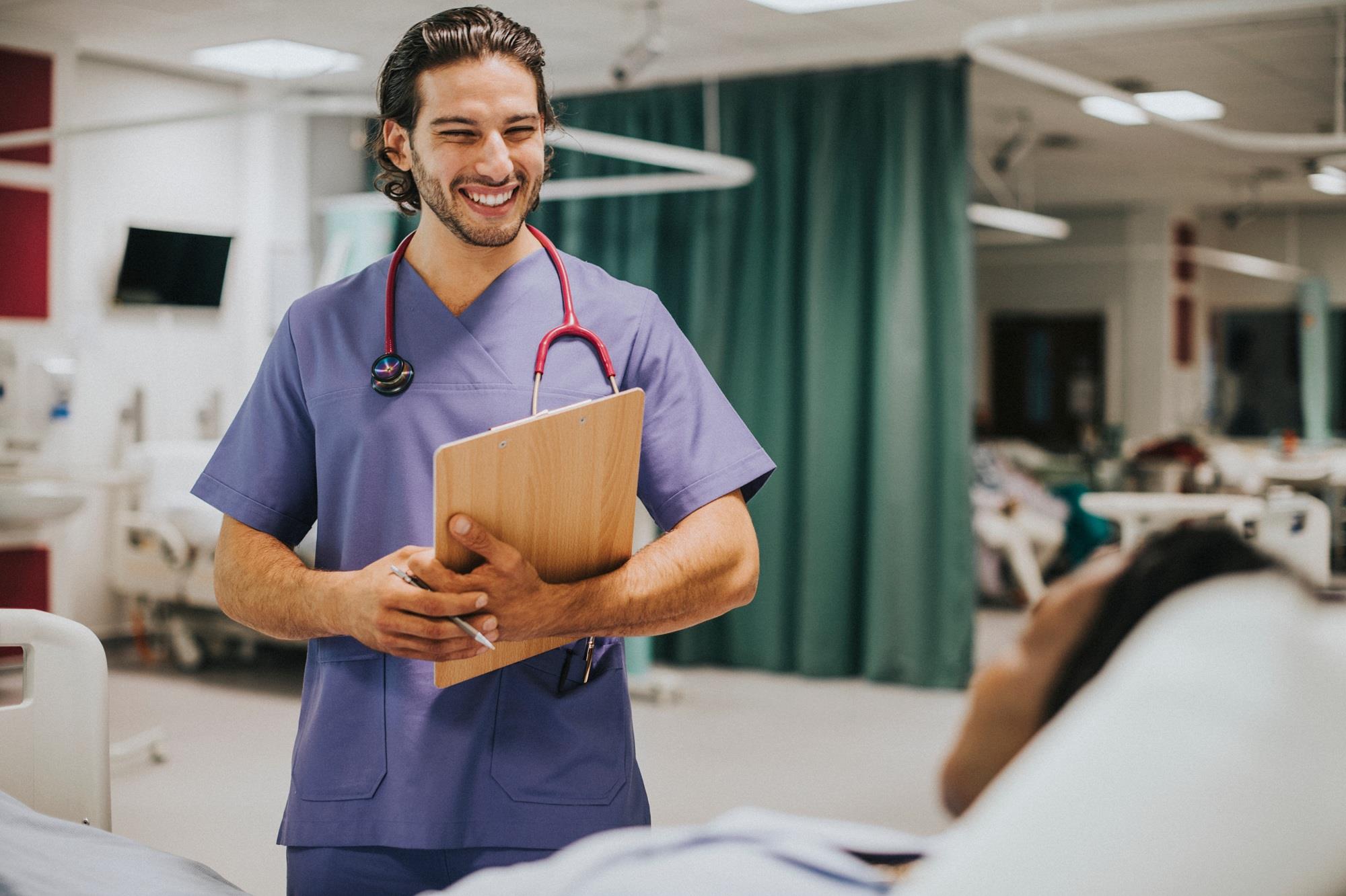 medical team member smiling at his patient