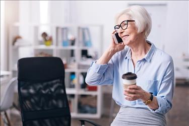 baby boomer job seeker on the phone with a potential employer