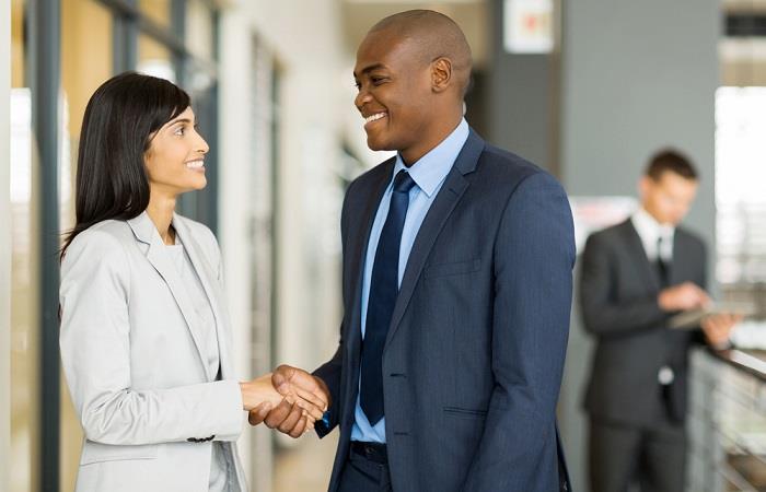 Candidate and interviewer shake hands