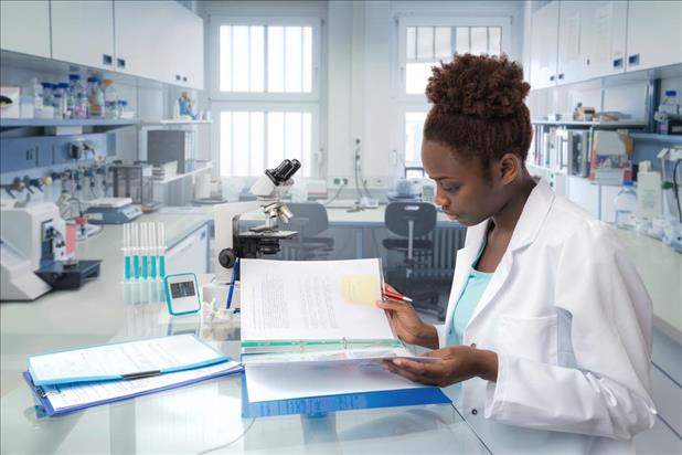 medical laboratory technician reviewing data in the lab