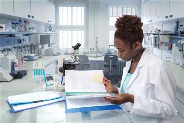 medical laboratory technician reviewing data in the lab