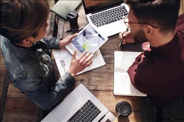 two people collaborating on a creative project