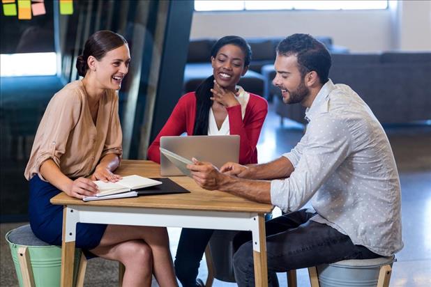 work colleagues meeting together and working on a project