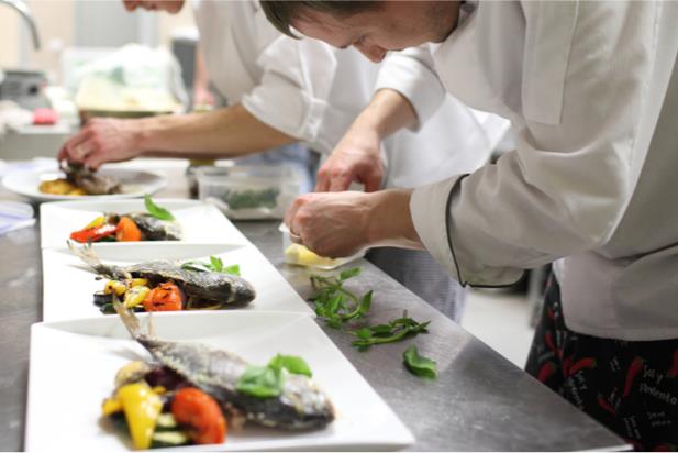 chefs plating food