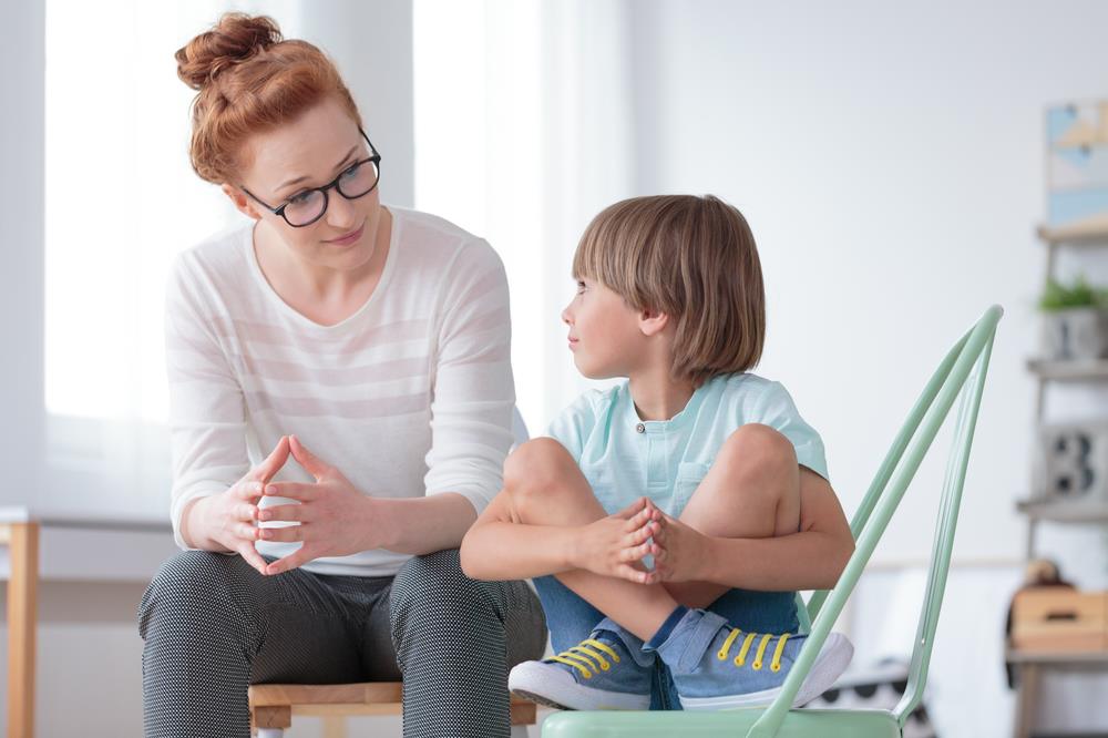 child counselor meeting with a young boy