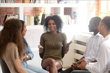 mental health counselor conducting a group therapy session