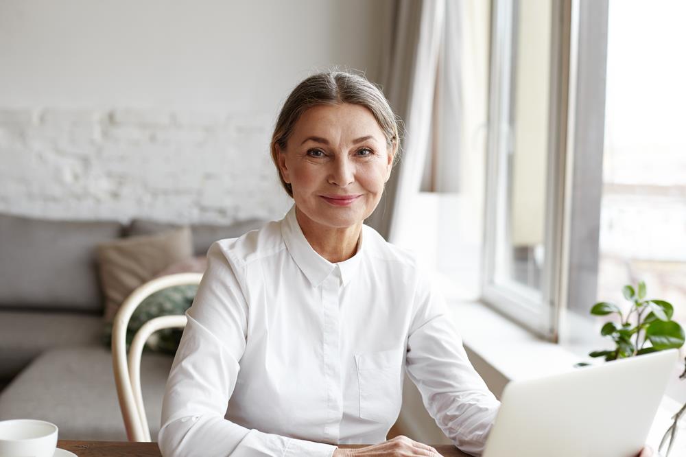 woman smiling during job search with career advisor