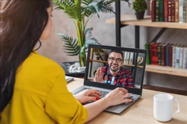 woman interviewing man on screen