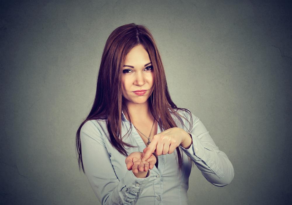 woman holding out her hand demanding money