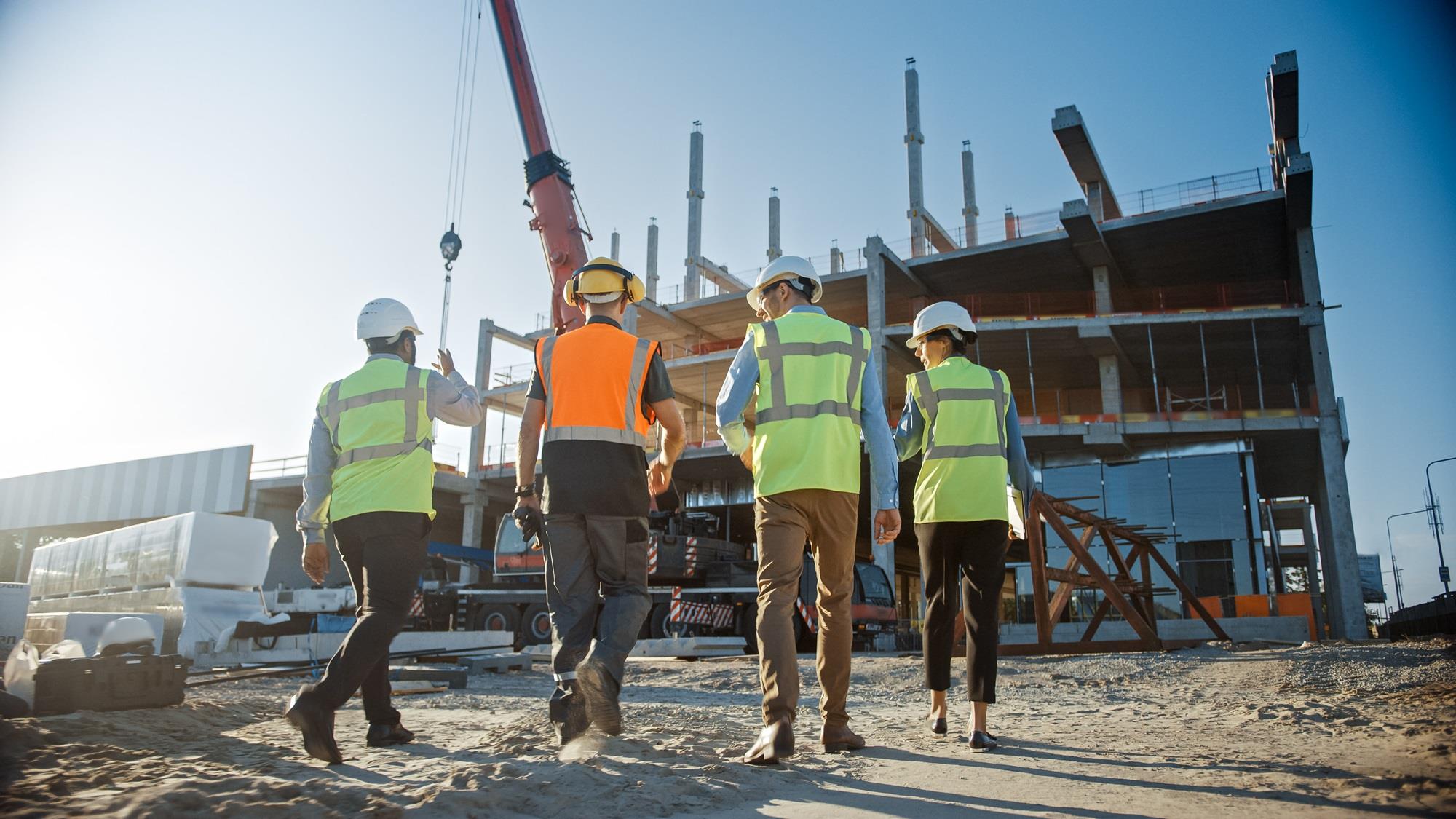 construction team walking toward their worksite