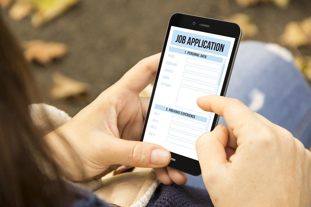 Candidate filling out job application on their smartphone