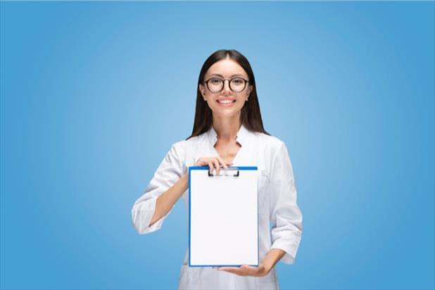 woman holding up a checklist