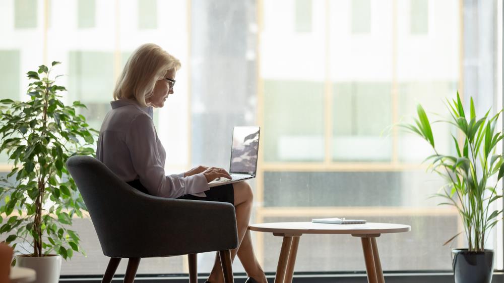 Woman on laptop preparing for her career change