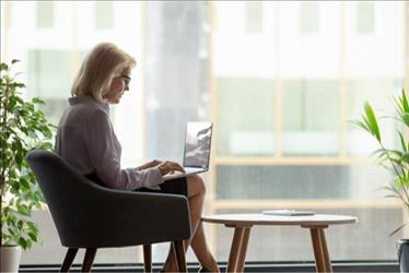 woman typing on computer