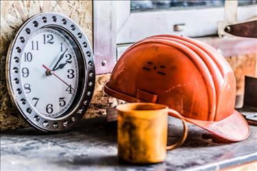 Construction hat next to clock