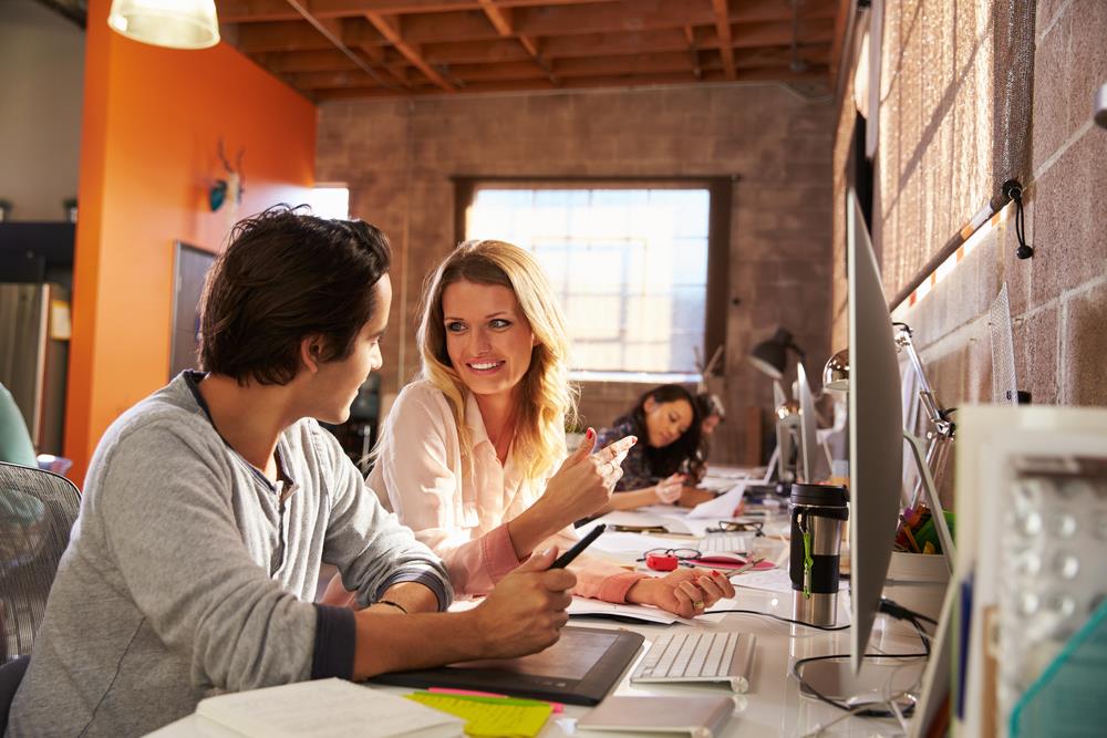 two employees collaborating in modern office