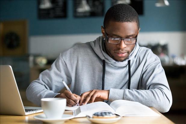 student studying a book