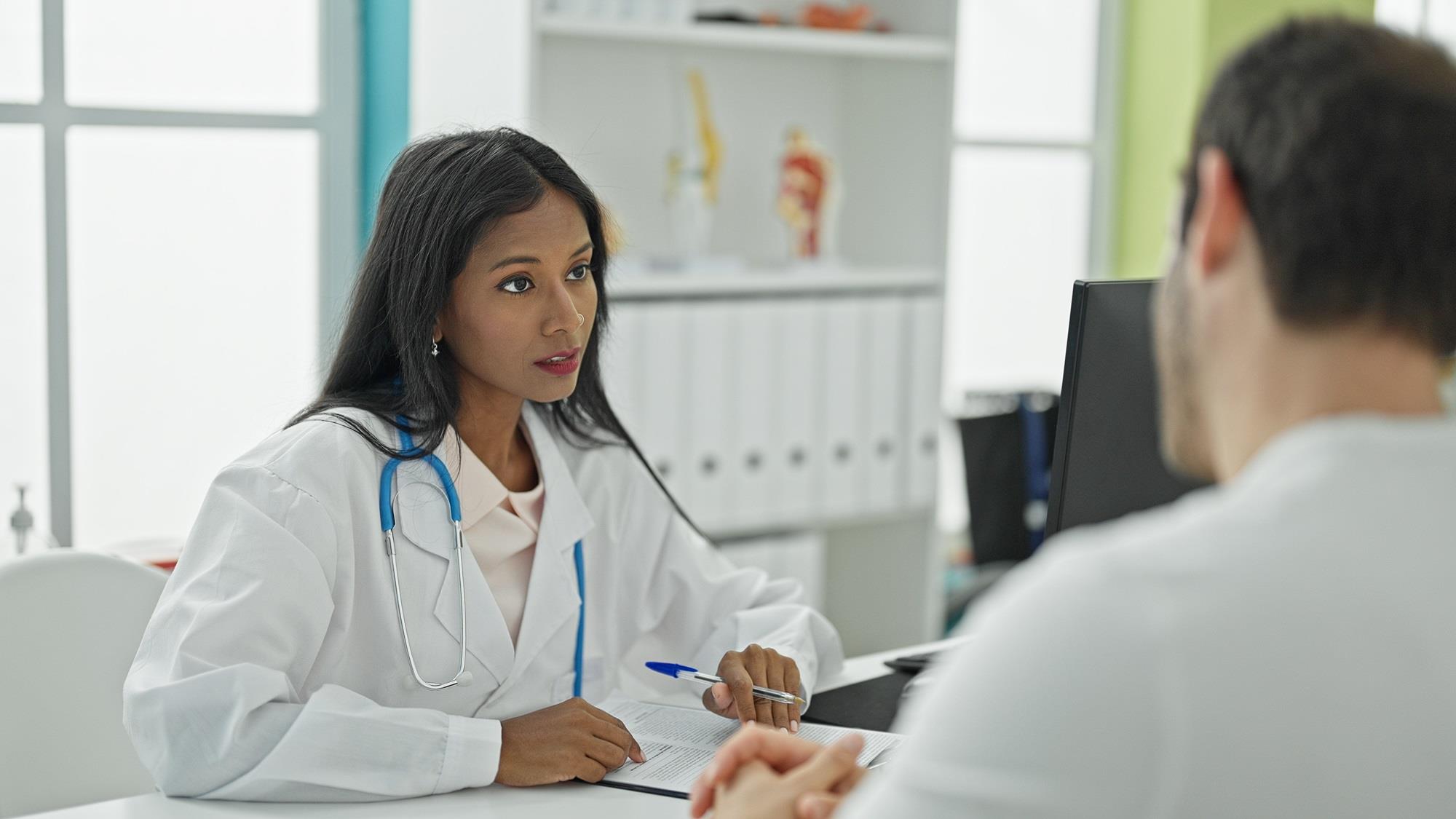 doctor participating in an exit interview at her desk