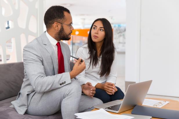 employees discussing a performance improvement plan