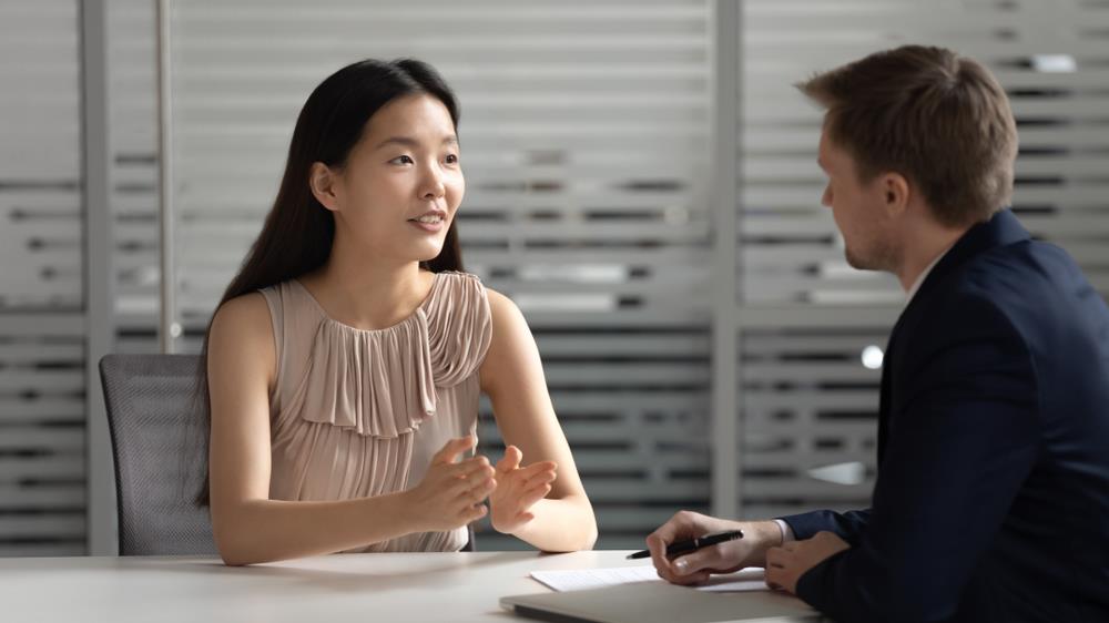 Woman asking question to interviewer