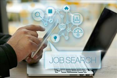 Job search on phone and laptop