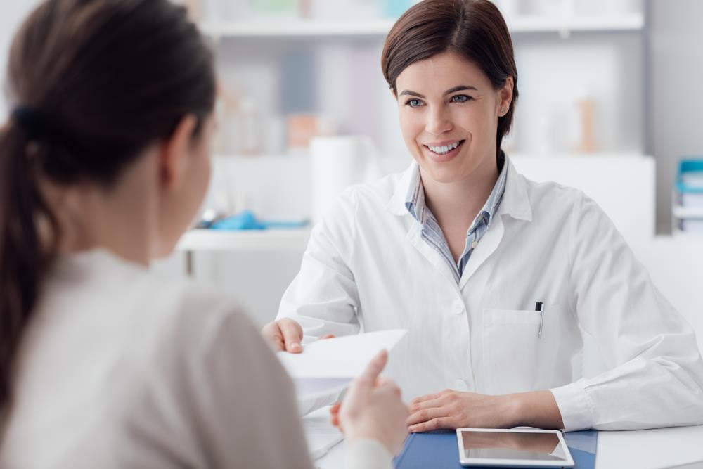 Optometric treatment coordinator discussing payment plans with patient