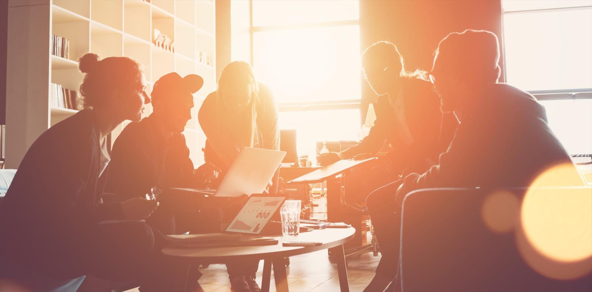 silhouette of a startup business team meeting on couches