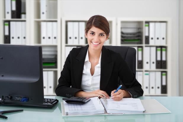 Young accountant enjoying the accounting career she has chosen.