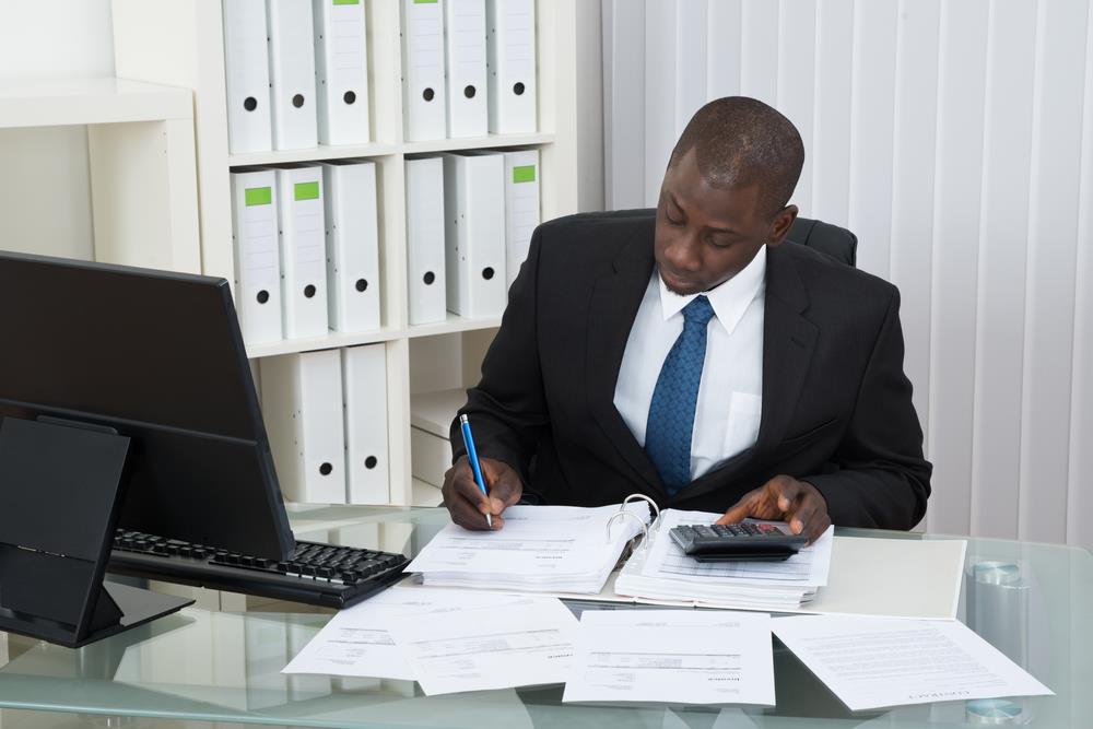 tax accountant reviewing financial information