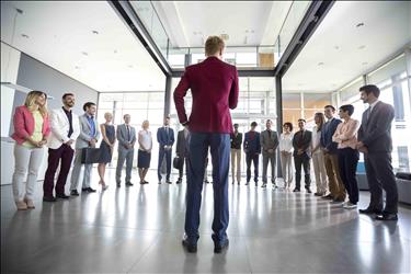 Successful CEO giving inspirational speech to employees