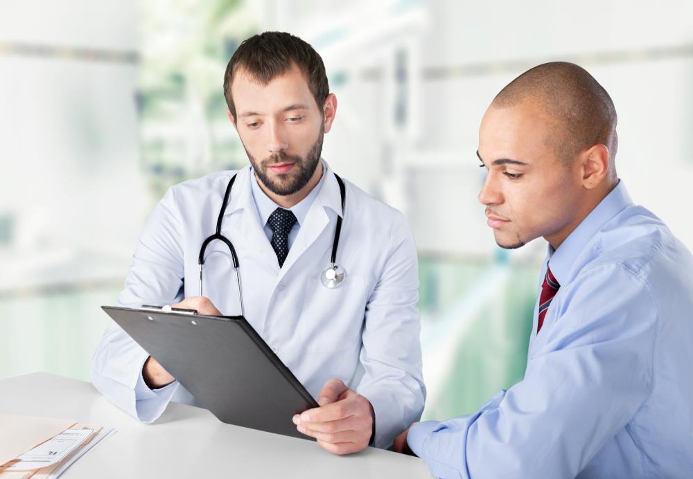 healthcare administrator looking at data with a physician