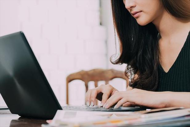 Job seekers focusing on laptop