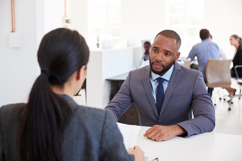 job seeker listening to their interviewer answer a question