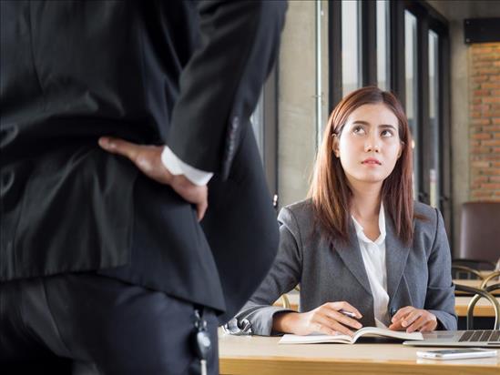 Photo of Employee in Uncomfortable Talk with Boss