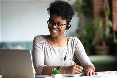 Smiling woman attending a remote work interview