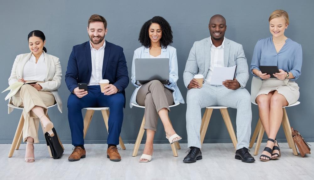 Diverse candidates sitting in chairs