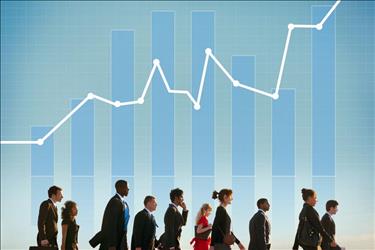 Group of professionals walking with line graph showing positive growth