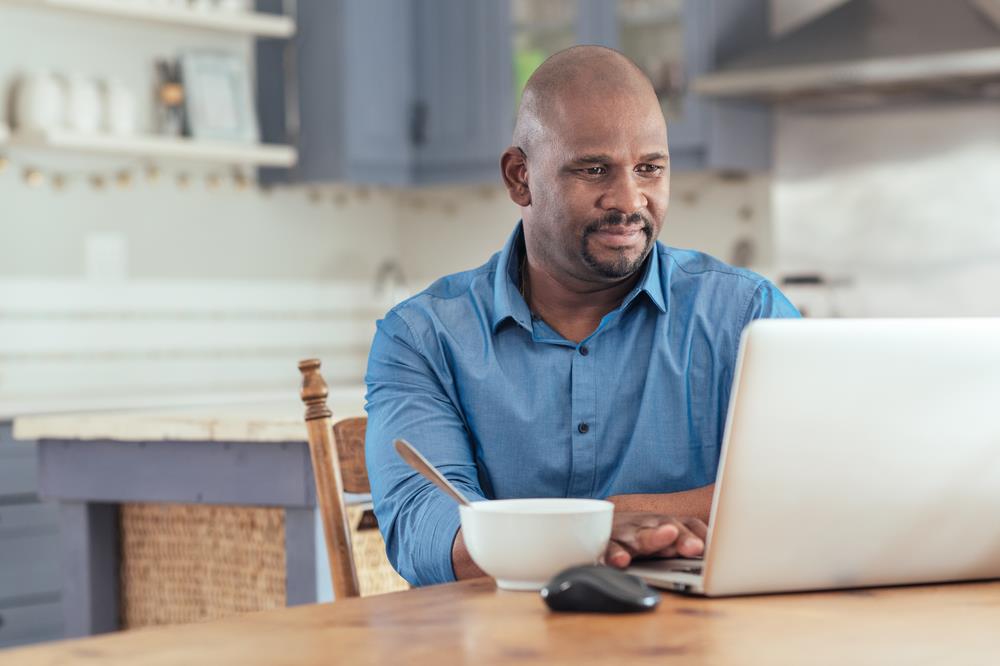 job seeker researching his interviewees and prospective employer online to prepare for an interview