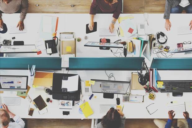 Top down view of employees working at computers