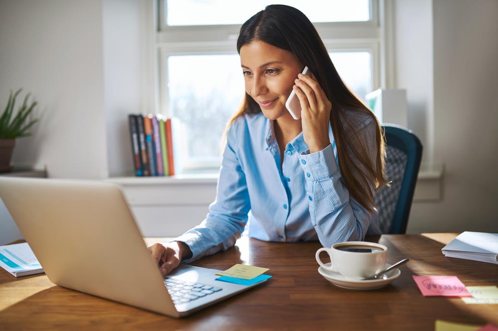 Woman on the phone while working part-time job from home