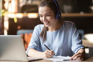 employee participating in virtual onboarding on laptop