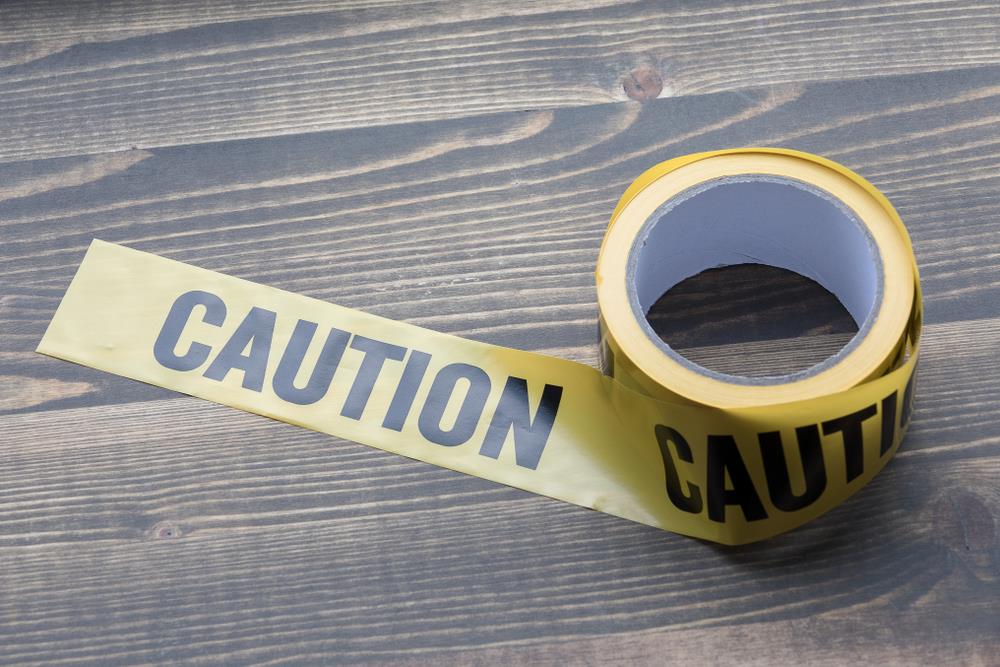 yellow caution tape on a desk