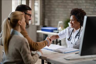 Doctor shaking hands with patient