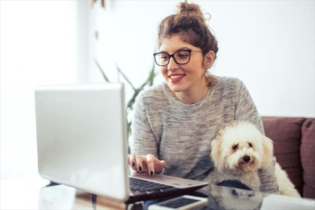 woman working from home with her dog