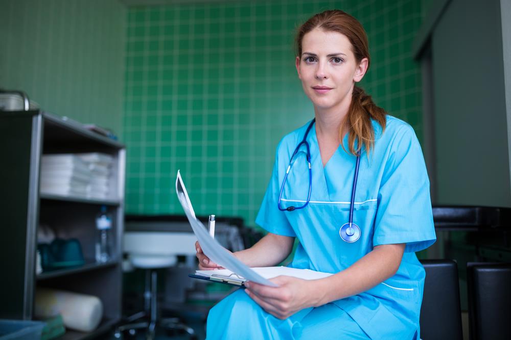 nurse practitioner posing in an outpatient center