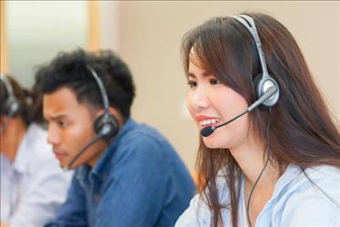 inside salesperson making phone calls with a headset